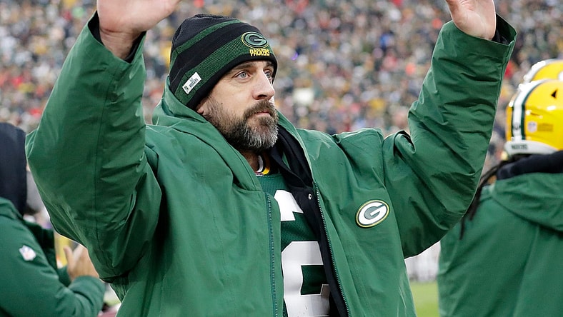 Green Bay Packers quarterback Aaron Rodgers (12) acknowledges the fans after he broke Brett Favre's team record for touchdown passes Sunday.

Syndication Packersnews