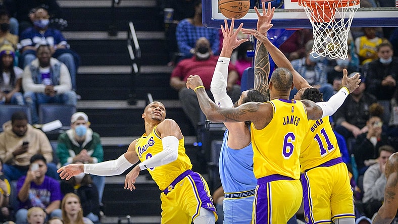 Dec 29, 2021; Memphis, Tennessee, USA; Los Angeles Lakers guard Russell Westbrook (0) and forward LeBron James (6) and guard Malik Monk (11) fight for the rebound with Memphis Grizzlies center Steven Adams (4) during the first quarter at the FedExForum. Mandatory Credit: Jerome Miron-USA TODAY Sports