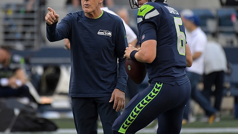 Aug 30, 2018; Seattle, WA, USA; Seattle Seahawks head coach Pete Carroll (left) talks with quarterback Austin Davis (6) against the Oakland Raiders during a preseason game at CenturyLink Field. The Raiders defeated the Seahawks 30-19. Mandatory Credit: Kirby Lee-USA TODAY Sports