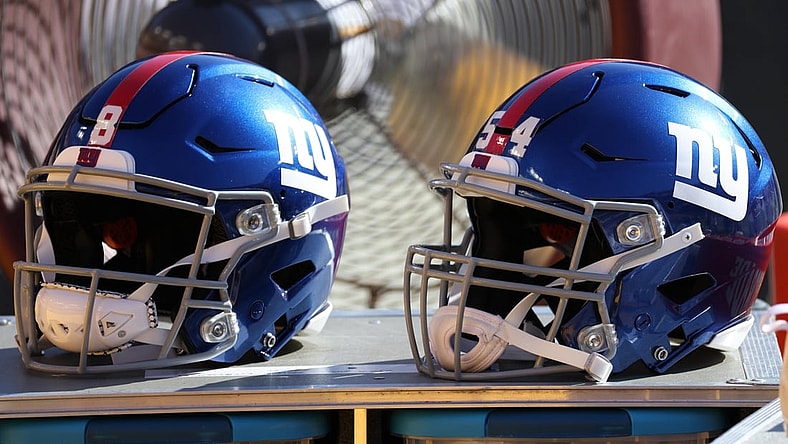 Nov 8, 2020; Landover, Maryland, USA; A view of the helmets of New York Giants quarterback Daniel Jones (8) and Giants inside linebacker Blake Martinez (54) resting on equipment case on the sidelines against the Washington Football Team at FedExField. Mandatory Credit: Geoff Burke-USA TODAY Sports