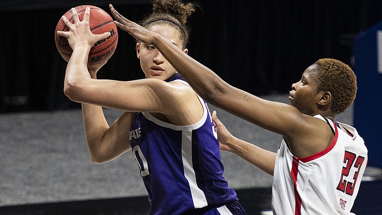 Mar 11, 2021; MO, Kansas City, USA; Kansas State Wildcats center Ayoka Lee (50) controls the ball against Texas Tech Lady Raiders center Khadija Faye (23) in the second half at Municipal Auditorium. Mandatory Credit: Amy Kontras-USA TODAY Sports