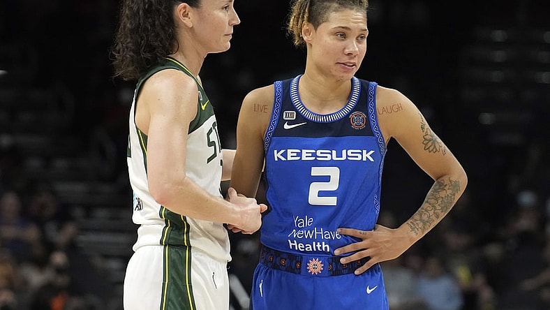 Aug 12, 2021; Phoenix, Arizona, USA; Seattle Storm guard Sue Bird (10) and Connecticut Sun guard Natisha Hiedeman (2) look on in the first half during the Inaugural WNBA Commissioners Cup Championship Game at Footprint Center. Mandatory Credit: Rick Scuteri-USA TODAY Sports
