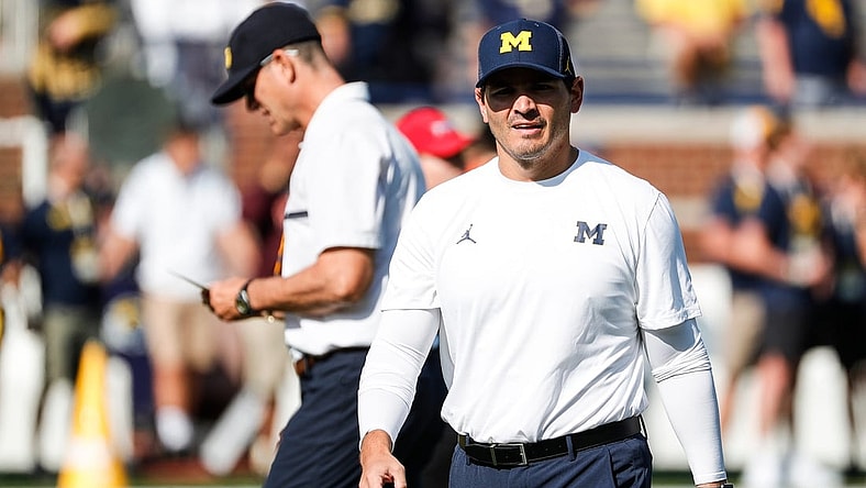 Michigan defensive coordinator Mike Macdonald watches warm up before a game against Northern Illinois at Michigan Stadium in Ann Arbor on Saturday, Sept. 18, 2021.