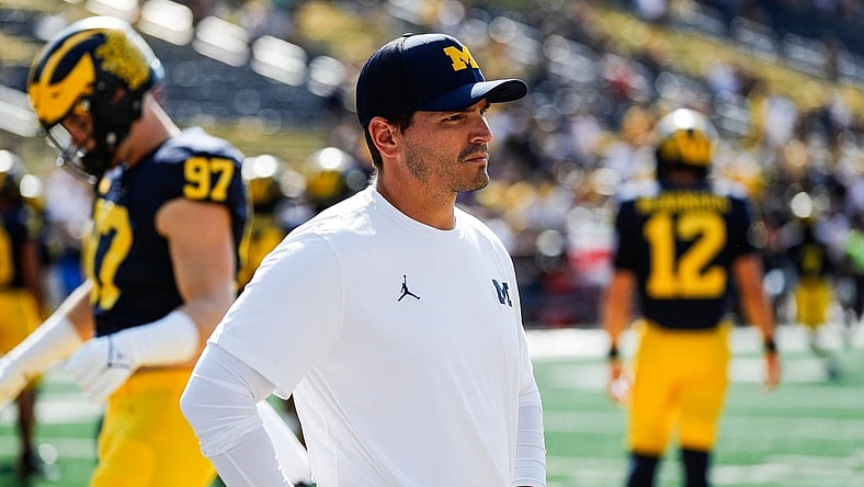 Michigan defensive coordinator Mike Macdonald watches warmups before a game against Northern Illinois at Michigan Stadium in Ann Arbor on Saturday, Sept. 18, 2021.