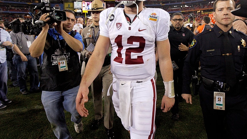 Stanford's Andrew Luck (12) walks of the field after losing the Fiesta Bowl between the Oklahoma State University Cowboys (OSU) and the Stanford Cardinal at the University of Phoenix Stadium in Glendale, Ariz., Tuesday, Jan. 3, 2012.

Osu101