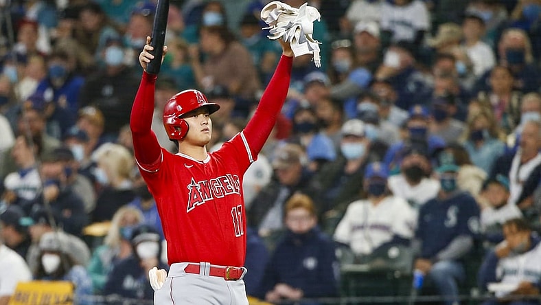 Oct 3, 2021; Seattle, Washington, USA; Los Angeles Angels designated hitter Shohei Ohtani (17) signals the bat boy after drawing an intentional walk against the Seattle Mariners during the second inning at T-Mobile Park. Mandatory Credit: Joe Nicholson-USA TODAY Sports