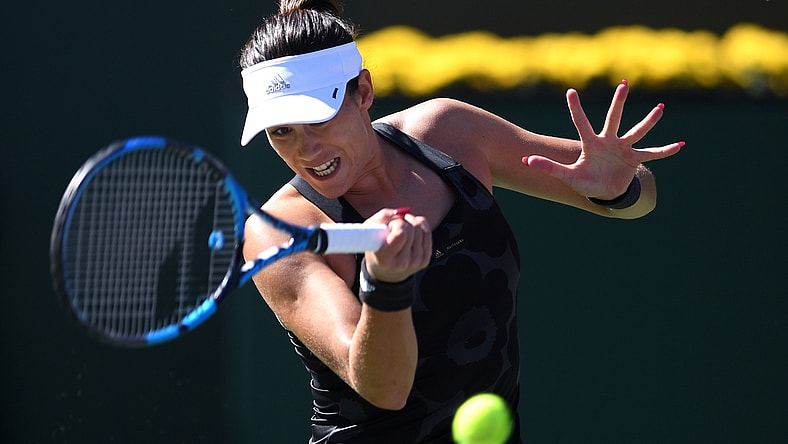 Oct 9, 2021; Indian Wells, CA, USA; Garbine Muguruza (ESP) hits a shot against Ajla Tomljanovic (AUS) at Indian Wells Tennis Garden. Mandatory Credit: Orlando Ramirez-USA TODAY Sports