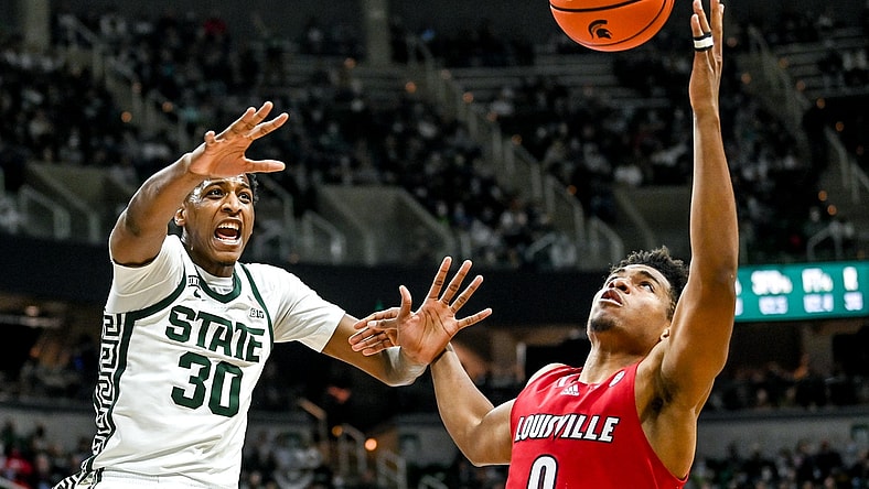 Michigan State's Marcus Bingham Jr., left, and Louisville's Noah Locke battle for a rebound during the second half on Wednesday, Dec. 1, 2021, at the Breslin Center in East Lansing.

211201 Msu Lville 160a