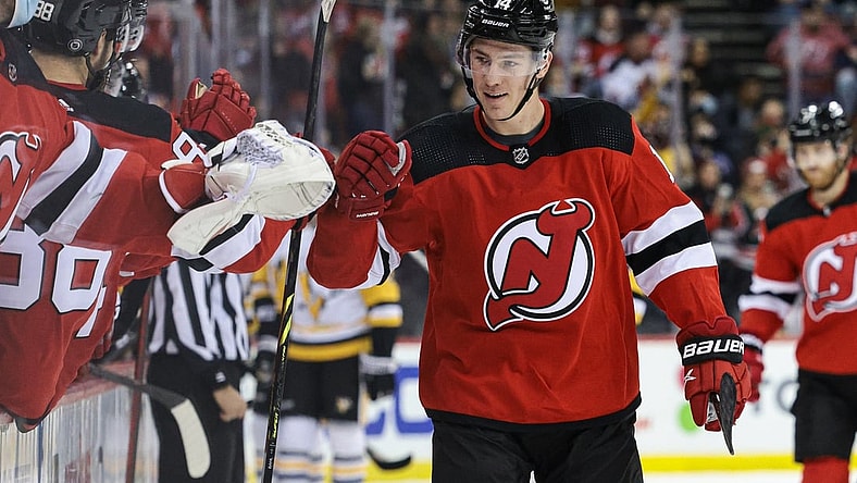 Dec 19, 2021; Newark, New Jersey, USA; New Jersey Devils right wing Nathan Bastian (14) celebrates his goal with teammates during the third period against the Pittsburgh Penguins at Prudential Center. Mandatory Credit: Vincent Carchietta-USA TODAY Sports