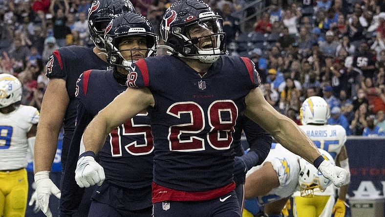 Dec 26, 2021; Houston, Texas, USA; Houston Texans running back Rex Burkhead (28) celebrates after scoring a touchdown against the Los Angeles Chargers in the fourth quarter at NRG Stadium. Mandatory Credit: Thomas Shea-USA TODAY Sports
