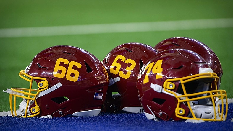 Dec 26, 2021; Arlington, Texas, USA; A view of the helmets of Washington Football Team offensive tackle David Steinmetz (66) and center Beau Benzschawel (63) before the game between the Dallas Cowboys and the Washington Football Team at AT&T Stadium. Mandatory Credit: Jerome Miron-USA TODAY Sports