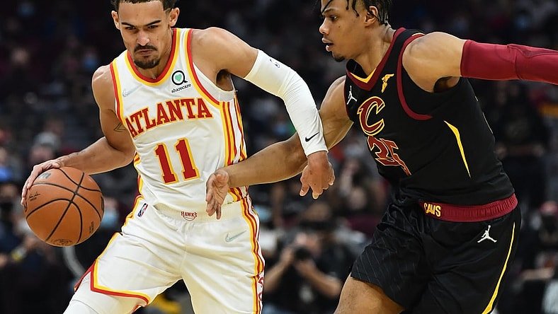 Dec 31, 2021; Cleveland, Ohio, USA; Atlanta Hawks guard Trae Young (11) drives to the basket against Cleveland Cavaliers forward Isaac Okoro (35) during the first half at Rocket Mortgage FieldHouse. Mandatory Credit: Ken Blaze-USA TODAY Sports