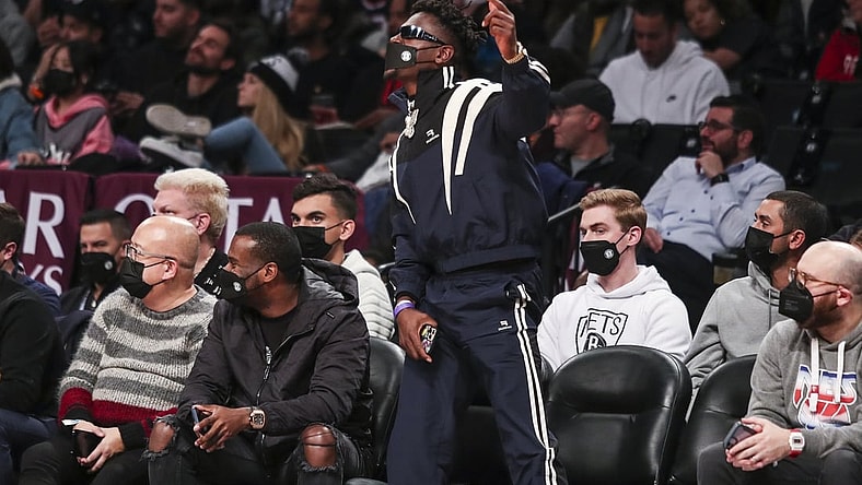Jan 3, 2022; Brooklyn, New York, USA;  Former NFL wide receiver Antonio Brown cheers during the game between the Memphis Grizzlies and Brooklyn Nets at Barclays Center. Mandatory Credit: Wendell Cruz-USA TODAY Sports