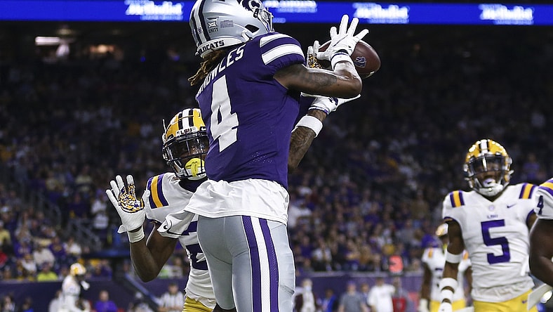 Jan 4, 2022; Houston, TX, USA; Kansas State Wildcats wide receiver Malik Knowles (4) makes a reception for a touchdown as LSU Tigers defensive back Damarius McGhee (26) defends during the second quarter during the 2022 Texas Bowl at NRG Stadium. Mandatory Credit: Troy Taormina-USA TODAY Sports
