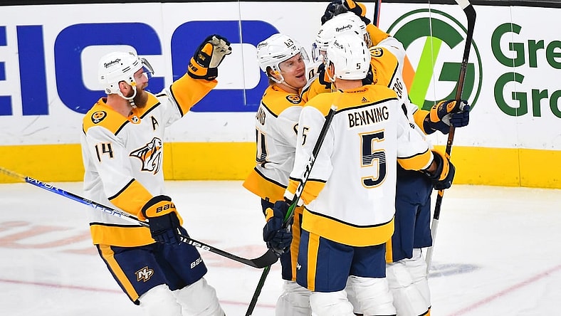 Jan 4, 2022; Las Vegas, Nevada, USA; Nashville Predators players celebrate a goal scored by Nashville Predators left wing Filip Forsberg (9) during the third period against the Vegas Golden Knights at T-Mobile Arena. Mandatory Credit: Stephen R. Sylvanie-USA TODAY Sports