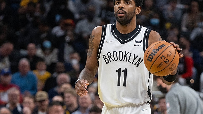 Jan 5, 2022; Indianapolis, Indiana, USA; Brooklyn Nets guard Kyrie Irving (11) dribbles the ball in the second half against the Indiana Pacers  at Gainbridge Fieldhouse. Mandatory Credit: Trevor Ruszkowski-USA TODAY Sports