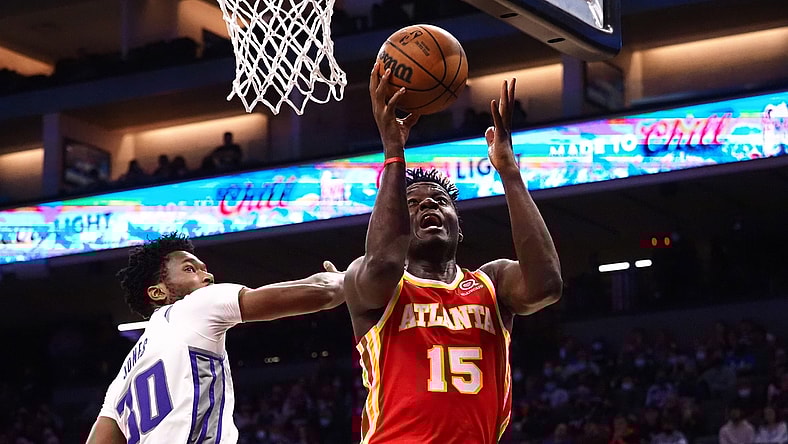 Jan 5, 2022; Sacramento, California, USA; Atlanta Hawks center Clint Capela (15) goes up for a shot against Sacramento Kings center Damian Jones (30) during the second quarter at Golden 1 Center. Mandatory Credit: Kelley L Cox-USA TODAY Sports
