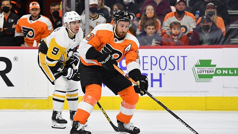 Jan 6, 2022; Philadelphia, Pennsylvania, USA; Philadelphia Flyers center Kevin Hayes (13) looks to pass against Pittsburgh Penguins center Evan Rodrigues (9) during the second period at Wells Fargo Center. Mandatory Credit: Eric Hartline-USA TODAY Sports