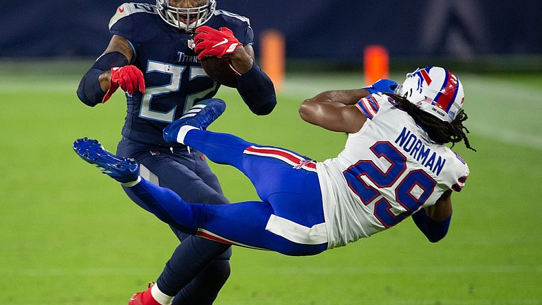 Tennessee Titans running back Derrick Henry (22) throws Buffalo Bills cornerback Josh Norman (29) aside as he rushes up the field during the second quarter at Nissan Stadium Tuesday, Oct. 13, 2020 in Nashville, Tenn.

Nas Titans Bills 001
