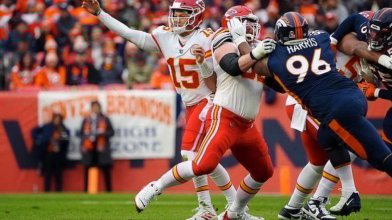 Jan 8, 2022; Denver, Colorado, USA; Kansas City Chiefs quarterback Patrick Mahomes (15) attempts a pass as guard Joe Thuney (62) defends against Denver Broncos defensive end Shelby Harris (96) in the first quarter at Empower Field at Mile High. Mandatory Credit: Ron Chenoy-USA TODAY Sports