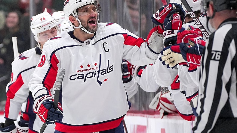 Jan 8, 2022; Saint Paul, Minnesota, USA;  Washington Capitals left wing Alex Ovechkin (8) celebrates after goal by center Evgeny Kuznetsov (92) against the Minnesota Wild in the second period at Xcel Energy Center. Mandatory Credit: Brad Rempel-USA TODAY Sports