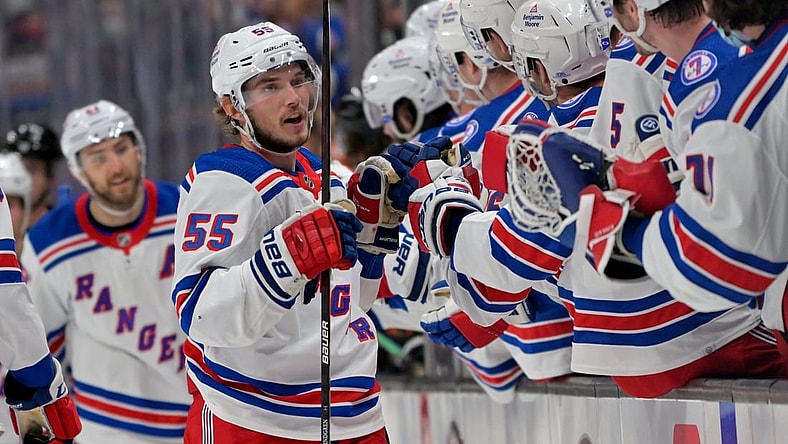 Jan 8, 2022; Anaheim, California, USA; New York Rangers defenseman Ryan Lindgren (55) is congratulated at the bench after scoring an empty net goal in the third period against the Anaheim Ducks at Honda Center. Mandatory Credit: Jayne Kamin-Oncea-USA TODAY Sports