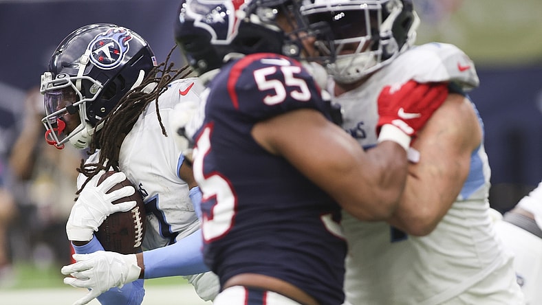 Jan 9, 2022; Houston, Texas, USA; Tennessee Titans running back D'Onta Foreman (7) rushes against the Houston Texans in the second quarter at NRG Stadium. Mandatory Credit: Thomas Shea-USA TODAY Sports