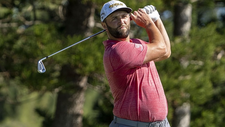 January 9, 2022; Maui, Hawaii, USA; Jon Rahm hits his tee shot on the second hole during the final round of the Sentry Tournament of Champions golf tournament at Kapalua Resort - The Plantation Course. Mandatory Credit: Kyle Terada-USA TODAY Sports