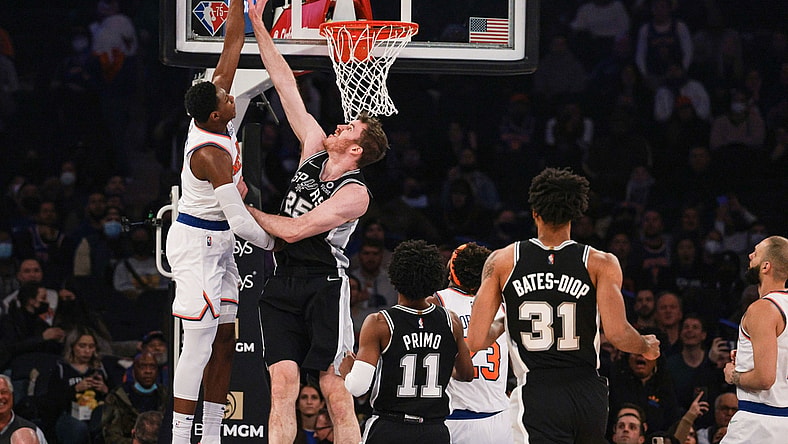 Jan 10, 2022; New York, New York, USA; San Antonio Spurs center Jakob Poeltl (25) blocks a shot by New York Knicks guard RJ Barrett (9) during the first half at Madison Square Garden. Mandatory Credit: Vincent Carchietta-USA TODAY Sports