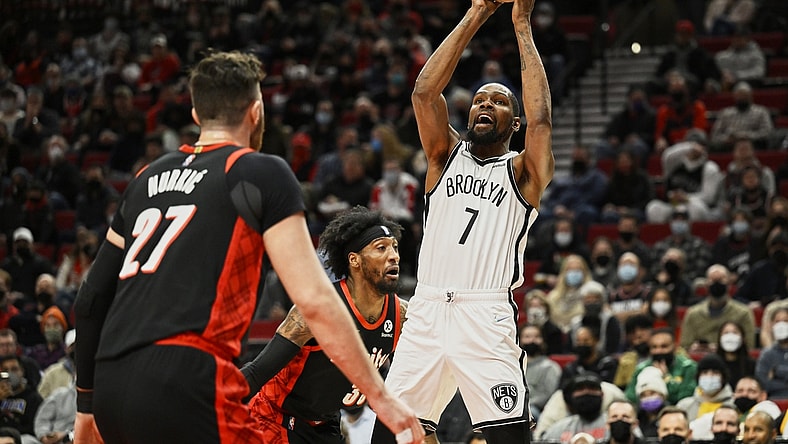 Jan 10, 2022; Portland, Oregon, USA;  Brooklyn Nets forward Kevin Durant (7) shoots a basket during the first half against Portland Trail Blazers forward Robert Covington (33) at Moda Center. Mandatory Credit: Troy Wayrynen-USA TODAY Sports