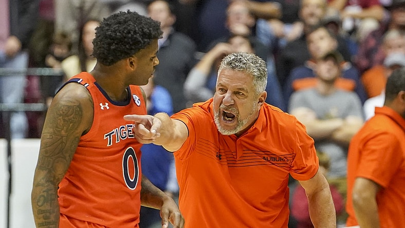 Jan 11, 2022; Tuscaloosa, Alabama, USA; Auburn Tigers head coach Bruce Pearl talks to Auburn Tigers guard K.D. Johnson (0) during the second half against Alabama Crimson Tide at Coleman Coliseum. Mandatory Credit: Marvin Gentry-USA TODAY Sports