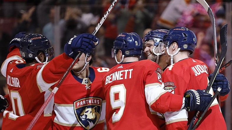 Jan 15, 2022; Sunrise, Florida, USA; Florida Panthers left wing Jonathan Huberdeau (11) celebrates with teammates after scoring a goal against the Columbus Blue Jackets during the second period at FLA Live Arena. Mandatory Credit: Sam Navarro-USA TODAY Sports