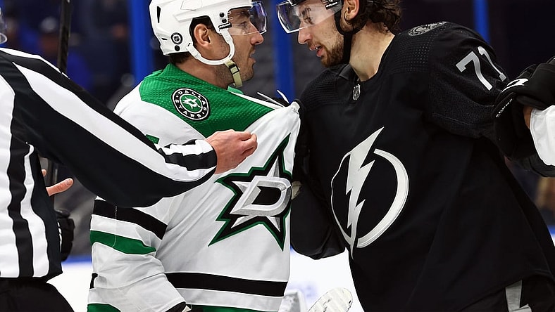 Jan 15, 2022; Tampa, Florida, USA; Dallas Stars defenseman Joel Hanley (44) and Tampa Bay Lightning left wing Pierre-Edouard Bellemare (41) talk during the first period at Amalie Arena. Mandatory Credit: Kim Klement-USA TODAY Sports