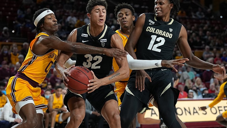 Jan 15, 2022; Tempe, Arizona, USA; Arizona State Sun Devils guard DJ Horne (0) defends against Colorado Buffaloes guard Nique Clifford (32) during the first half at Desert Financial Arena. Mandatory Credit: Joe Camporeale-USA TODAY Sports