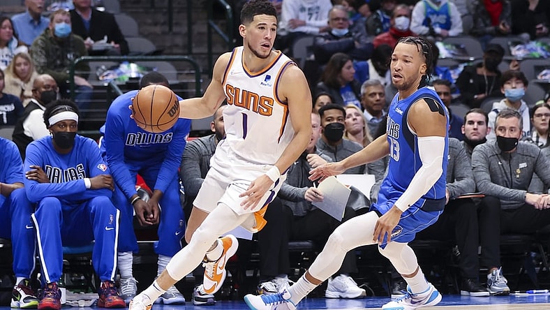 Jan 20, 2022; Dallas, Texas, USA;  Phoenix Suns guard Devin Booker (1) drives to the basket past Dallas Mavericks guard Jalen Brunson (13) during the first half at American Airlines Center. Mandatory Credit: Kevin Jairaj-USA TODAY Sports