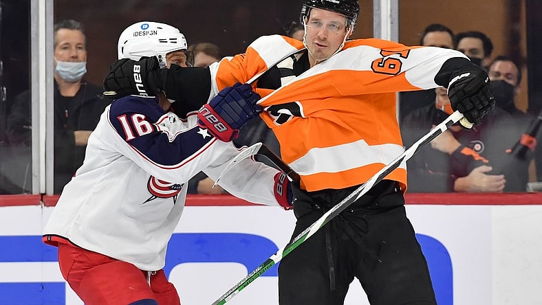 Jan 20, 2022; Philadelphia, Pennsylvania, USA; Columbus Blue Jackets center Max Domi (16) battles for the puck with Philadelphia Flyers defenseman Justin Braun (61) during the first period at Wells Fargo Center. Mandatory Credit: Eric Hartline-USA TODAY Sports