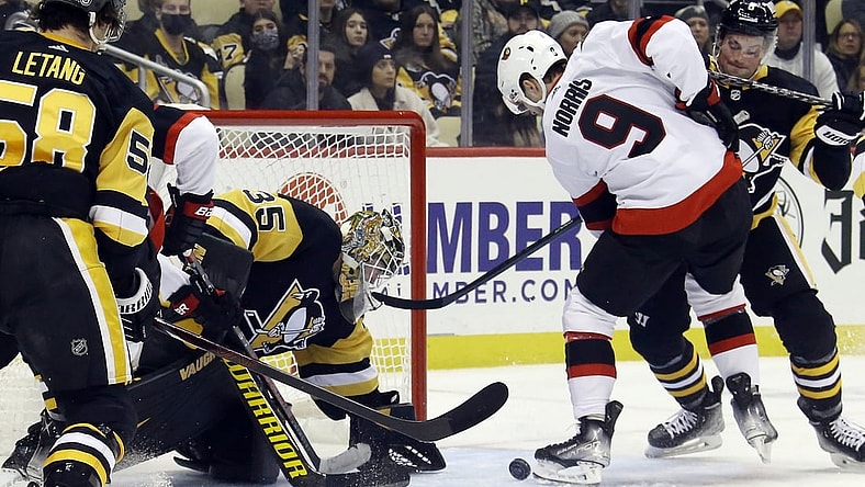 eJan 20, 2022; Pittsburgh, Pennsylvania, USA;  Pittsburgh Penguins goaltender Tristan Jarry (35) makes a save against Ottawa Senators center Josh Norris (9) during the first period at PPG Paints Arena. Mandatory Credit: Charles LeClaire-USA TODAY Sports