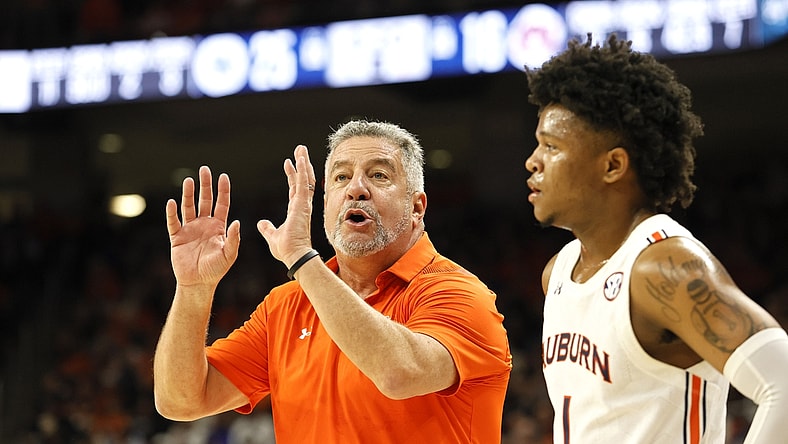 Jan 22, 2022; Auburn, Alabama, USA;  Auburn Tigers head coach Bruce Pearl talks to guard Wendell Green Jr. (1) during a time out in the first half against the Kentucky Wildcats at Auburn Arena. Mandatory Credit: John Reed-USA TODAY Sports