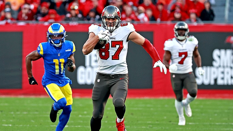 Jan 23, 2022; Tampa, Florida, USA; Tampa Bay Buccaneers tight end Rob Gronkowski (87) runs the ball against Los Angeles Rams cornerback Darious Williams (11) during the second half in a NFC Divisional playoff football game at Raymond James Stadium. Mandatory Credit: Matt Pendleton-USA TODAY Sports