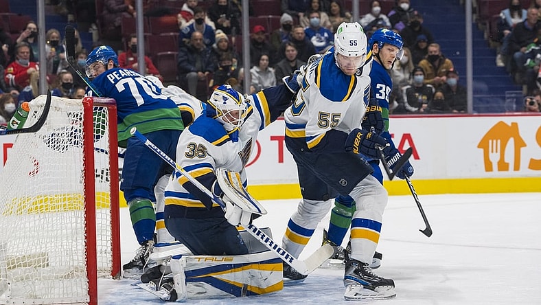 Jan 23, 2022; Vancouver, British Columbia, CAN; St. Louis Blues defenseman Colton Parayko (55) looks on as goalie Ville Husso (35) makes a save against the Vancouver Canucks  in the first period at Rogers Arena. Mandatory Credit: Bob Frid-USA TODAY Sports