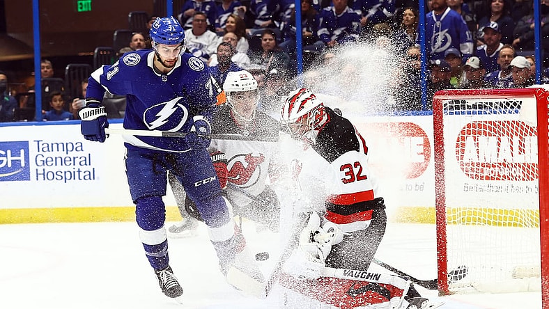 Jan 27, 2022; Tampa, Florida, USA; New Jersey Devils goaltender Jon Gillies (32) makes a save against the Tampa Bay Lightning during the first period at Amalie Arena. Mandatory Credit: Kim Klement-USA TODAY Sports