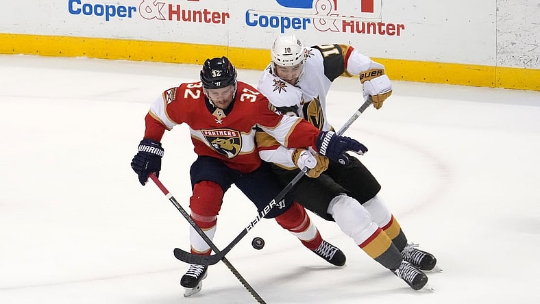 Jan 27, 2022; Sunrise, Florida, USA; Vegas Golden Knights center Nicolas Roy (10) battles Florida Panthers defenseman Lucas Carlsson (32) for the puck during the second period at FLA Live Arena. Mandatory Credit: Jasen Vinlove-USA TODAY Sports
