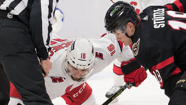 Jan 27, 2022; Ottawa, Ontario, CAN; Carolina Hurricanes cente Vincent Trocheck (16) faces off against Ottawa Senators left wing Tim St tzle (18) in the second period at the Canadian Tire Centre. Mandatory Credit: Marc DesRosiers-USA TODAY Sports