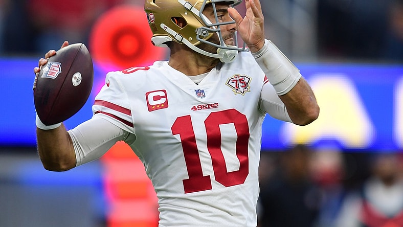 Jan 30, 2022; Inglewood, California, USA;  San Francisco 49ers quarterback Jimmy Garoppolo throws a pass against the Los Angeles Rams during the NFC Championship Game at SoFi Stadium. Mandatory Credit: Gary A. Vasquez-USA TODAY Sports