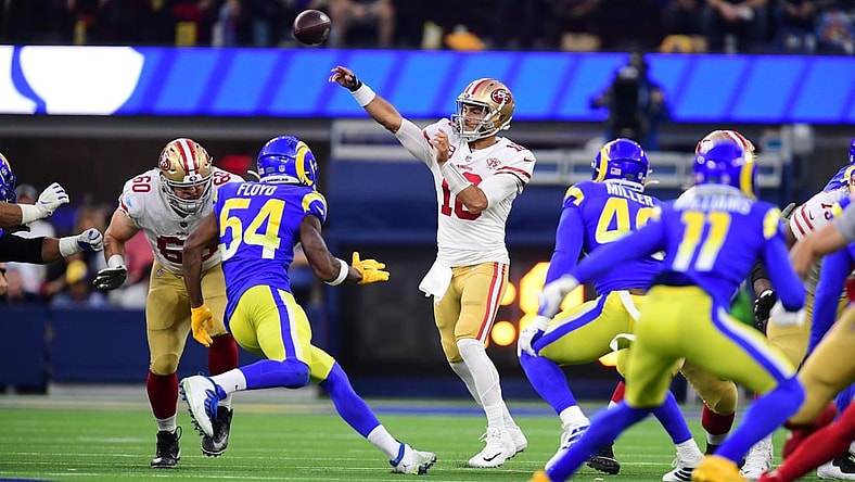 Jan 30, 2022; Inglewood, California, USA; San Francisco 49ers quarterback Jimmy Garoppolo (10) throws a pass against the Los Angeles Rams in the first half during the NFC Championship Game at SoFi Stadium. Mandatory Credit: Gary A. Vasquez-USA TODAY Sports