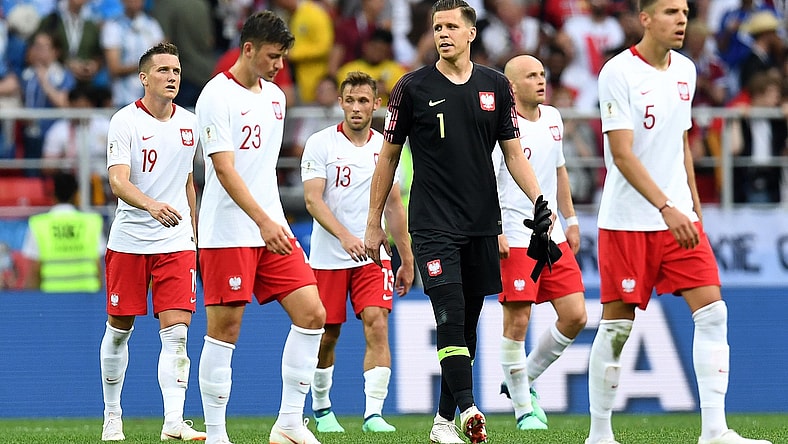 Jun 19, 2018; Moscow, Russia; Poland players walk off the field with goalkeeper Wojciech Szczesny (1) after losing to Senegal in Group H play during the FIFA World Cup 2018 at Spartak Stadium. Mandatory Credit: Tim Groothuis/Witters Sport via USA TODAY Sports