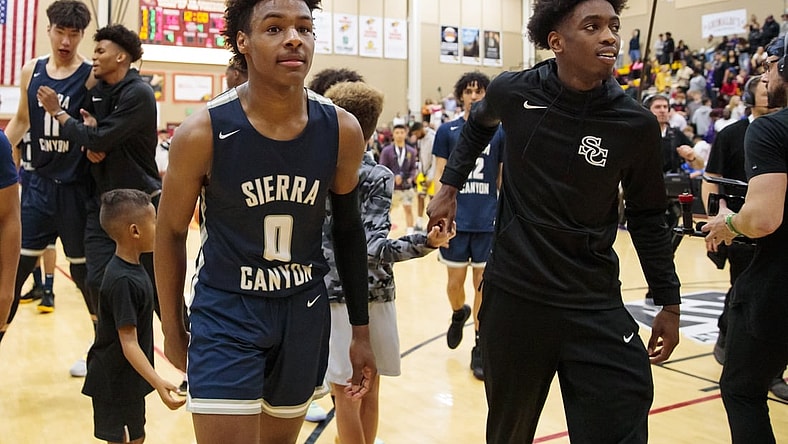 Dec 7, 2019; Scottsdale, AZ, USA; Sierra Canyon School guard LeBron James Jr (0) and teammate Zaire Wade against Millennium High School during the 2019 Hoophall West basketball tournament at Chaparral High School. Mandatory Credit: Mark J. Rebilas-USA TODAY Sports