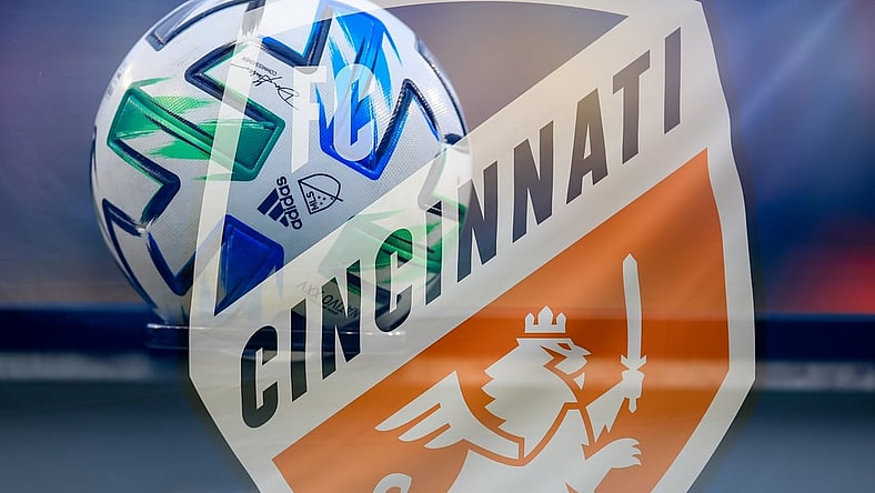 Aug 21, 2020; Cincinnati, OH, USA; (editors note: multiple exposure in camera used for this photo) A view of an official Adidas MLS game ball and the Cincinnati logo during the game between D.C. United and FC Cincinnati at Nippert Stadium. Mandatory Credit: Aaron Doster-USA TODAY Sports