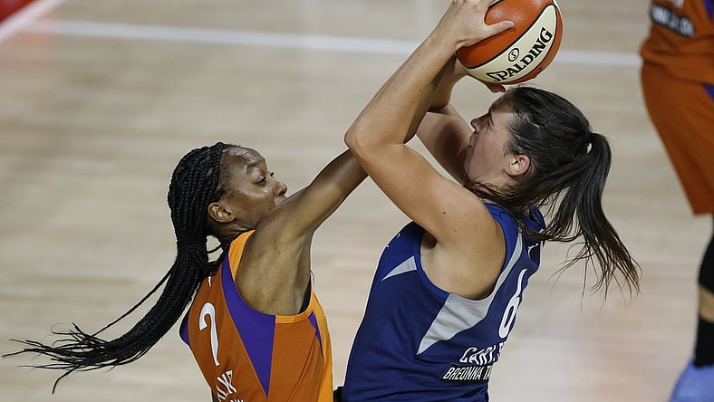 Sep 17, 2020; Palmetto, Florida, USA; Phoenix Mercury guard Shatori Walker-Kimbrough (2) guards Minnesota Lynx guard Bridget Carleton (6) during the first half at the FELD entertainment complex. Mandatory Credit: Reinhold Matay-USA TODAY Sports