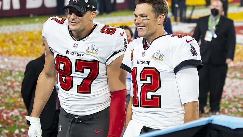 Feb 7, 2021; Tampa, FL, USA;  Tampa Bay Buccaneers quarterback Tom Brady (12) and tight end Rob Gronkowski (87) celebrate after beating the Kansas City Chiefs in Super Bowl LV at Raymond James Stadium.  Mandatory Credit: Mark J. Rebilas-USA TODAY Sports